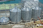 Steelwork being erected around silos