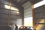 Inside of the refuse sorting building, showing the mechanism for the large vehicle doors